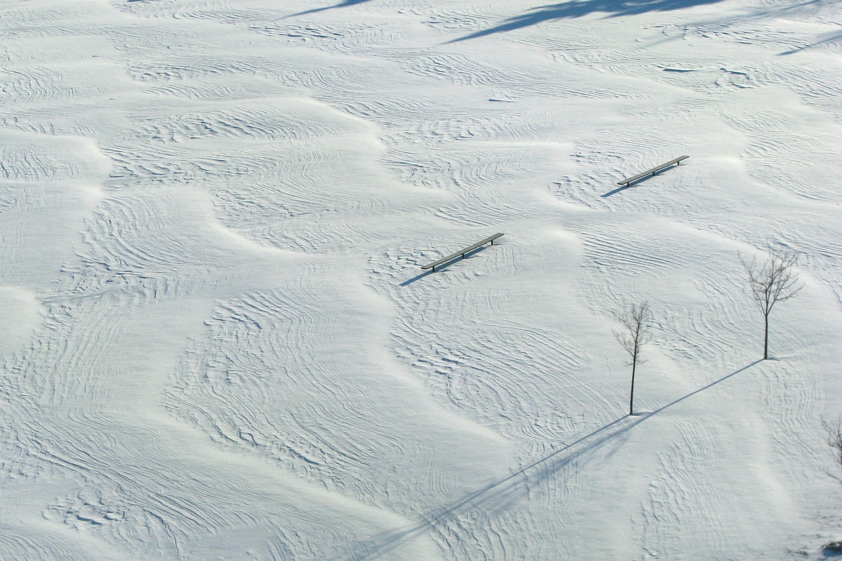 A sports field covered in snow shaped like waves. Taken By Adrian Berg.